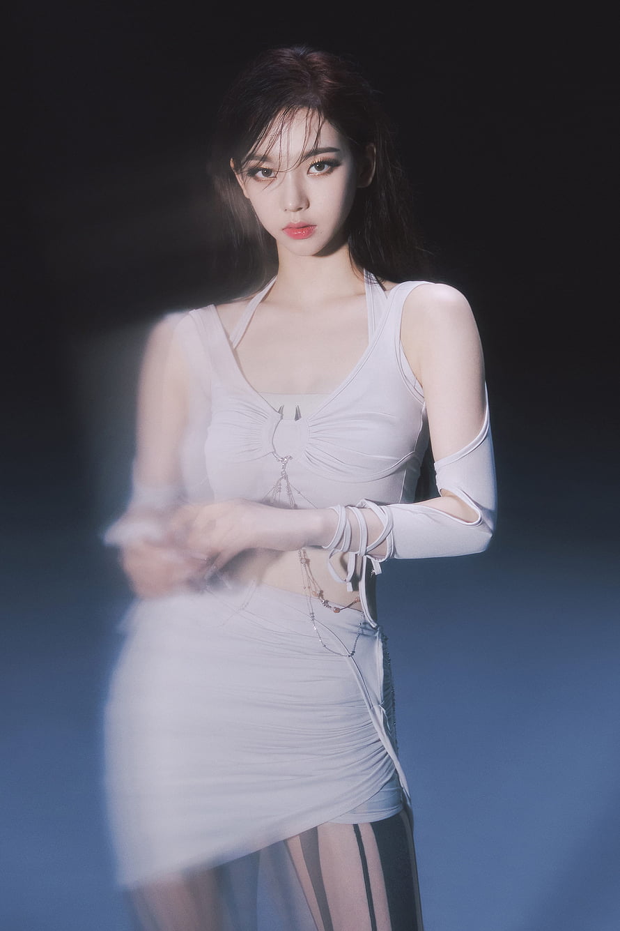 Karina from aespa in a white halter top and ruched skirt with dramatic studio lighting HD phone wallpaper
