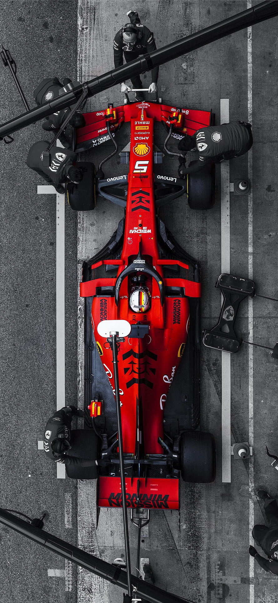 Top-Down View of Ferrari F1 Car in Pit Lane with Crew HD phone wallpaper