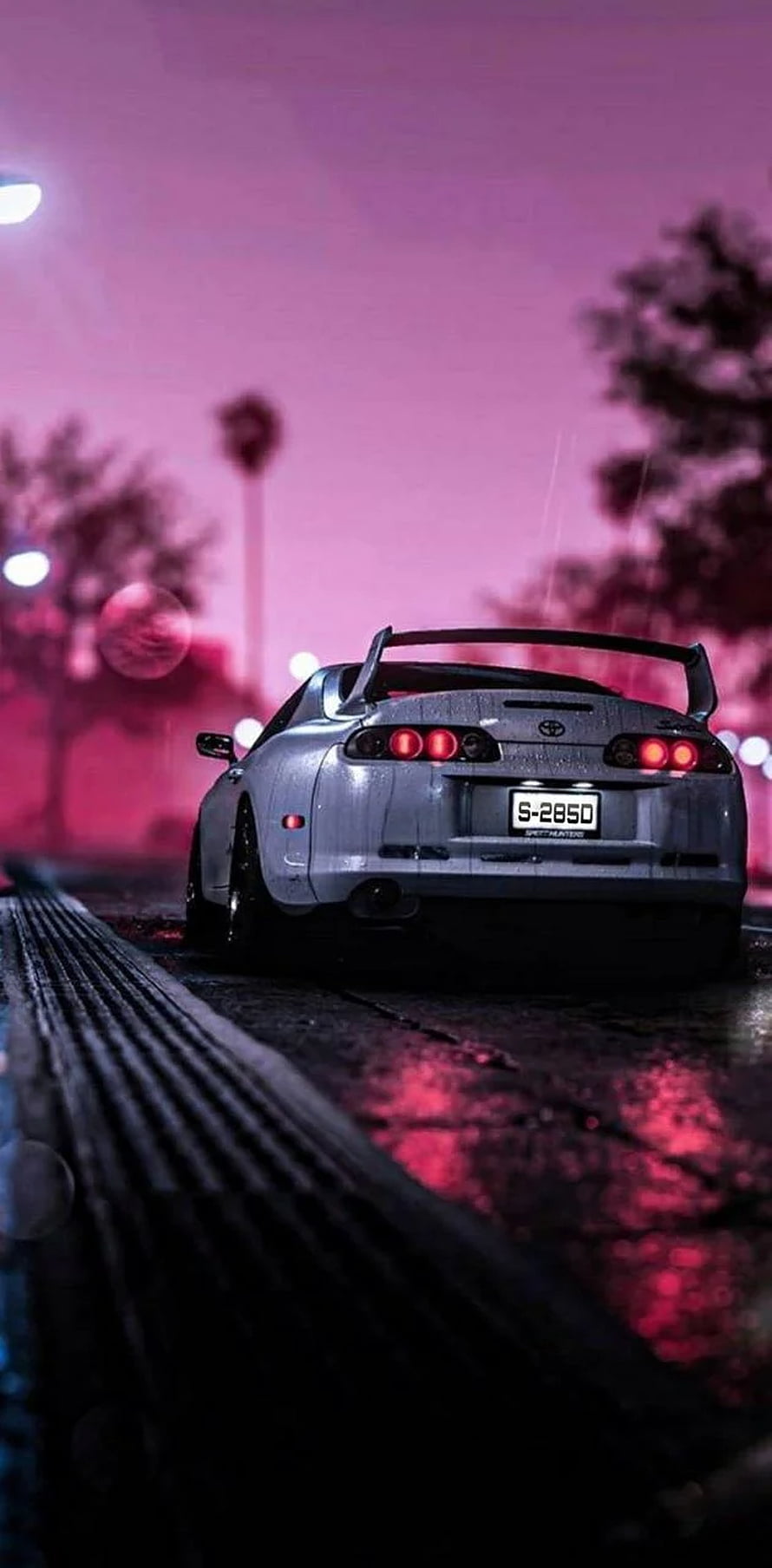 Rear View of a Silver Toyota Supra Parked on a Wet Street Under a Neon Pink Sky HD phone wallpaper