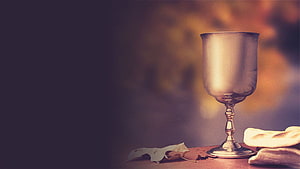 Silver Chalice and Bread on Wooden Table with Warm Autumnal Background HD wallpaper