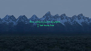 Snow-Capped Mountain Range at Dusk with Lyric Overlay HD wallpaper