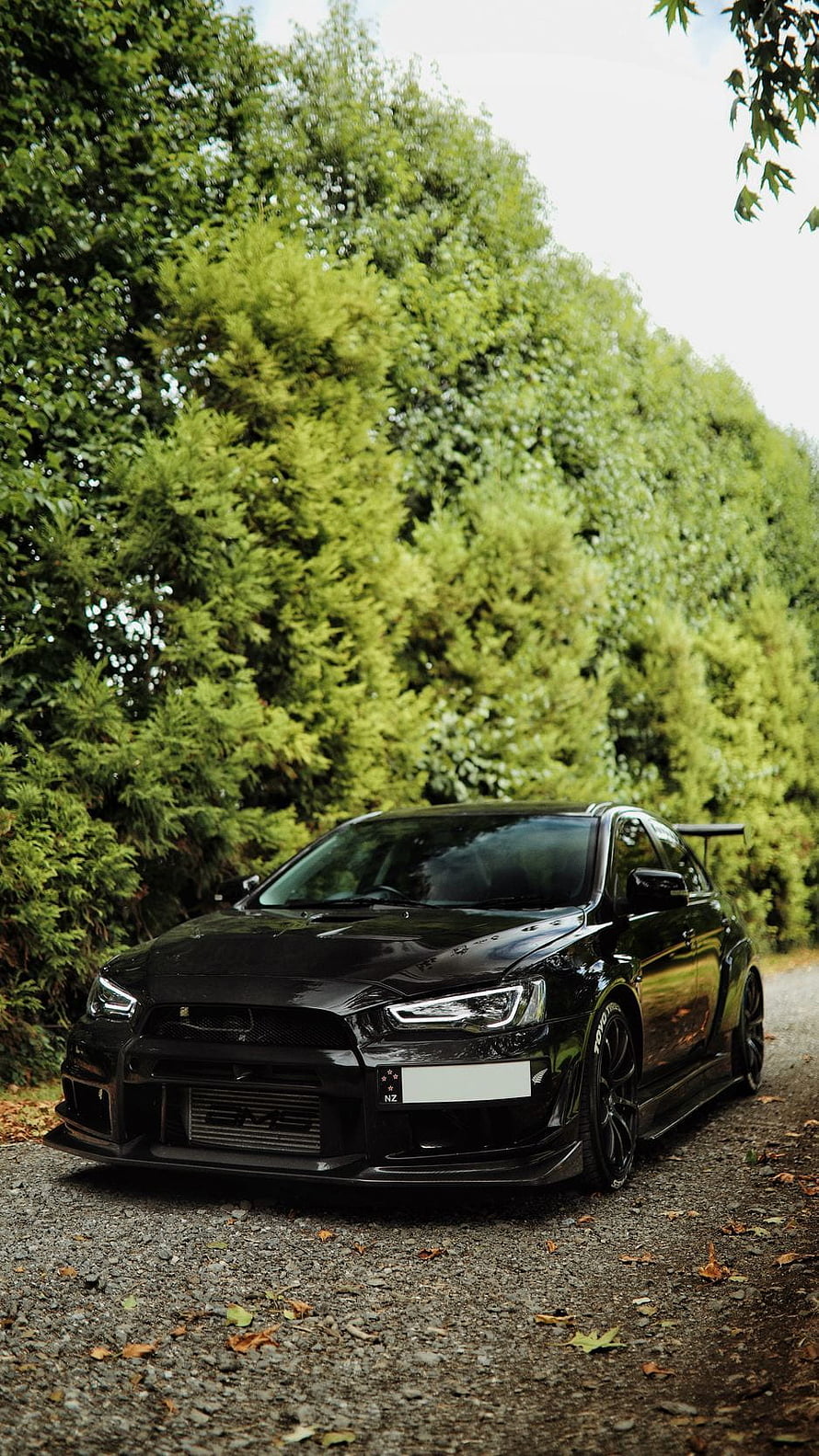 Black Mitsubishi Lancer Evolution X Widebody Stance on Gravel Road HD phone wallpaper