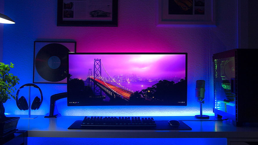 Neon RGB Gaming Desk Setup with Ultrawide Monitor and PC Tower HD wallpaper