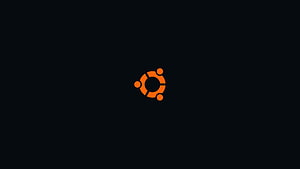 Ubuntu Orange Logo Centered on Minimalist Black Background HD wallpaper