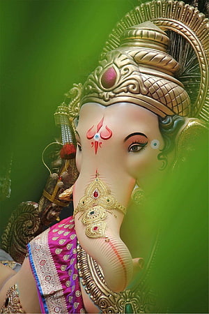 Chintamani Ganpati Murti with Ornate Gold Crown and Traditional Indian Attire HD phone wallpaper