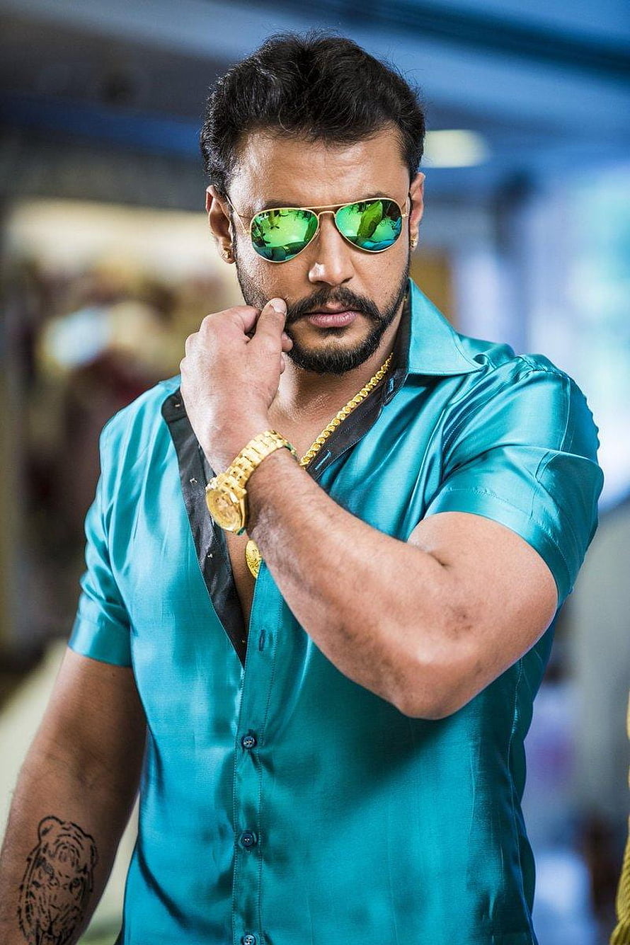 Darshan in Teal Silk Shirt with Green Aviator Sunglasses and Gold Accessories HD phone wallpaper