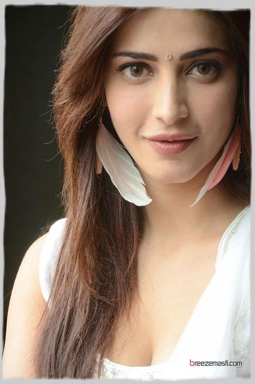 Shruthi Hasan Portrait with Feather Earrings and White Top HD phone wallpaper