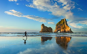Woman Jogging on Wet Sand with Dramatic Sea Stacks and Reflections, windows 10, woman jogging, beach HD wallpaper