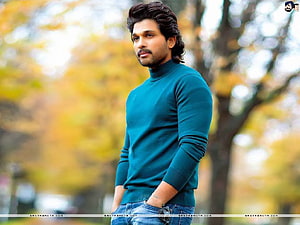 Allu Arjun in a teal turtleneck sweater with an autumn park backdrop HD wallpaper