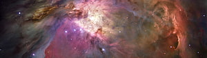 Vibrant Cosmic Nebula with Swirling Gas Clouds and Distant Stars HD wallpaper