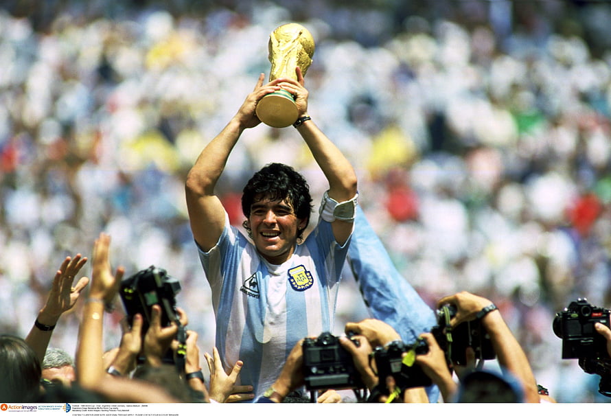Diego Maradona lifting the FIFA World Cup trophy in his Argentina jersey HD wallpaper