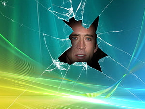 Nicolas Cage Peering Through Shattered Glass with Vibrant Light Streaks HD wallpaper