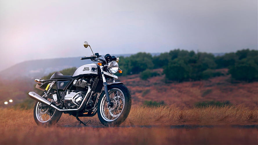 Royal Enfield Continental GT 650 Motorcycle Parked in Golden Grassland at Dusk HD wallpaper