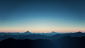 Minimalist Mountain Silhouette Landscape at Dawn with Soft Gradient Sky HD wallpaper