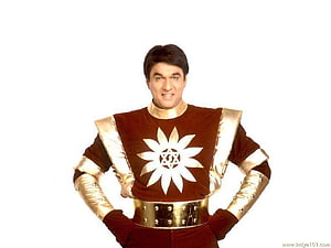 Shaktimaan in Iconic Brown and Gold Superhero Costume with Star Emblem HD wallpaper