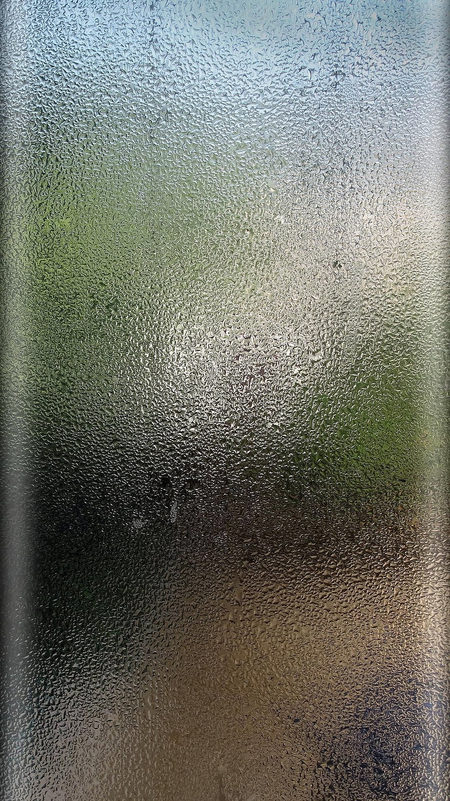 Raindrops on Textured Glass with Soft Green and Amber Light HD phone wallpaper