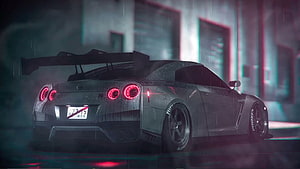 Nissan GT-R R35 Rear View in Rainy Night Setting with Neon Red Taillights and Large Rear Wing HD wallpaper