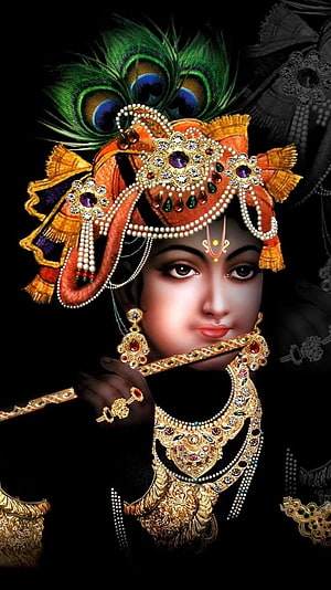 Shri Krishna Portrait with Peacock Crown and Ornate Gold Jewelry on Black Background HD phone wallpaper