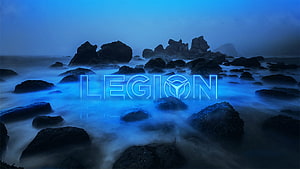 Lenovo Legion Glowing Logo Over Misty Blue Rocky Coastline HD wallpaper