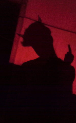 Red Devil Boy Silhouette with Horns and Gun in Dark Moody Atmosphere HD phone wallpaper