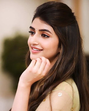 Sree Leela smiling portrait with long dark hair and elegant yellow outfit HD phone wallpaper