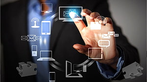 Businessman Interacting With Digital Connectivity Icons And Devices HD wallpaper