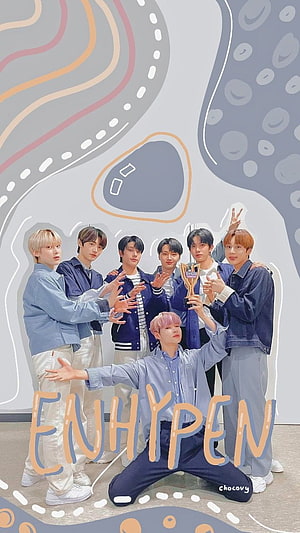 ENHYPEN K-Pop Group Photo with Show Champion Trophy and Illustrative Background HD phone wallpaper