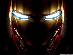 Iron Man Close-Up Portrait with Glowing Blue Eyes and Golden Armor HD wallpaper