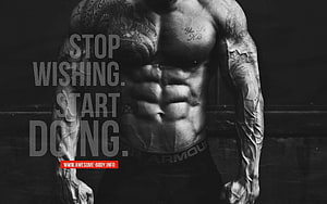 Black and White Muscular Male Torso with Extensive Tattoos and Motivational Gym Quote HD wallpaper