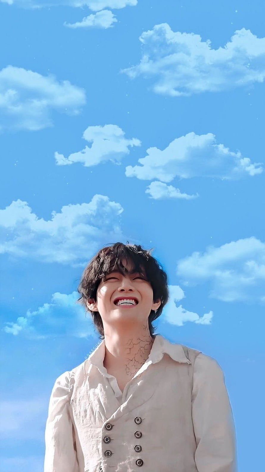 BTS V Kim Taehyung Smiling Under a Bright Blue Sky with Fluffy White Clouds HD phone wallpaper