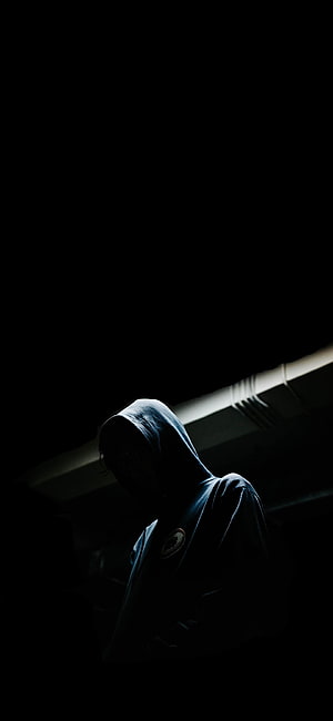 Moody Hooded Figure in Dramatic Low-Key Lighting HD phone wallpaper