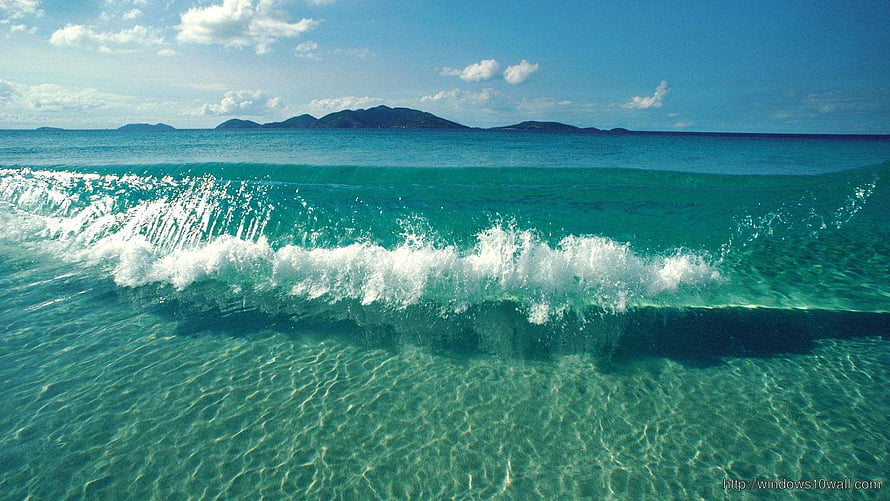 Tropical Beach Wave Breaking in Turquoise Water with Distant Island Horizon HD wallpaper
