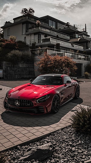 Red Mercedes-AMG GT R Parked in Front of Modern Luxury Villa HD phone wallpaper