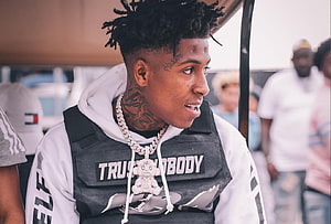 NBA YoungBoy in White Hoodie and Black Vest with Diamond Chain and Teddy Bear Pendant HD wallpaper