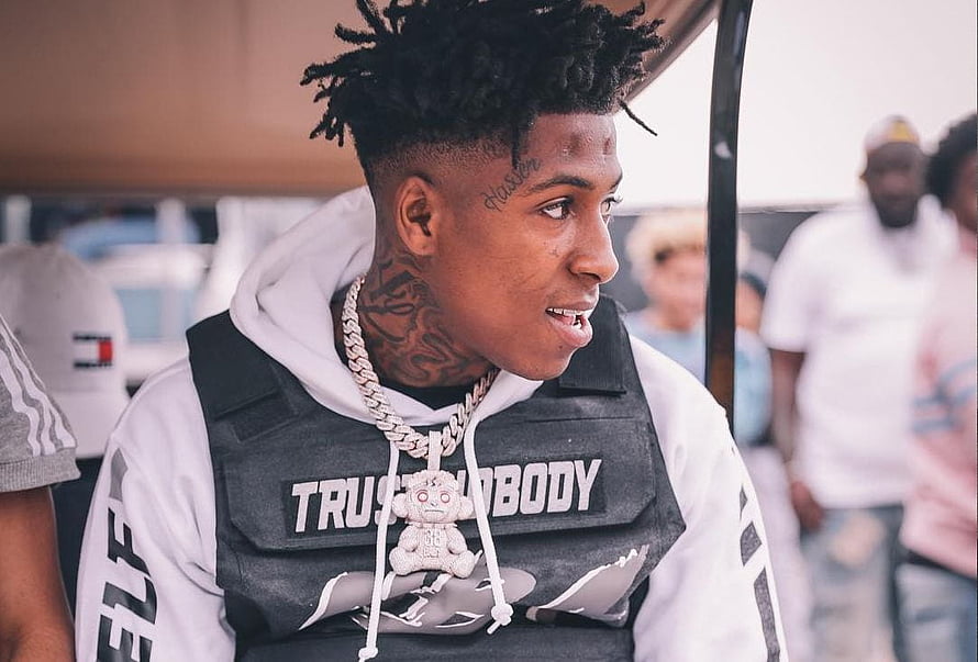 NBA YoungBoy in White Hoodie and Black Vest with Diamond Chain and Teddy Bear Pendant HD wallpaper