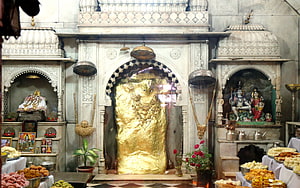 Mehandipur Balaji Temple Shrine with Golden Idol and Prasad Offerings HD wallpaper