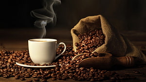 Steaming White Coffee Cup with Roasted Beans in Burlap Sack and Wooden Scoop HD wallpaper