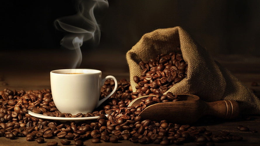 Steaming White Coffee Cup with Roasted Beans in Burlap Sack and Wooden Scoop HD wallpaper