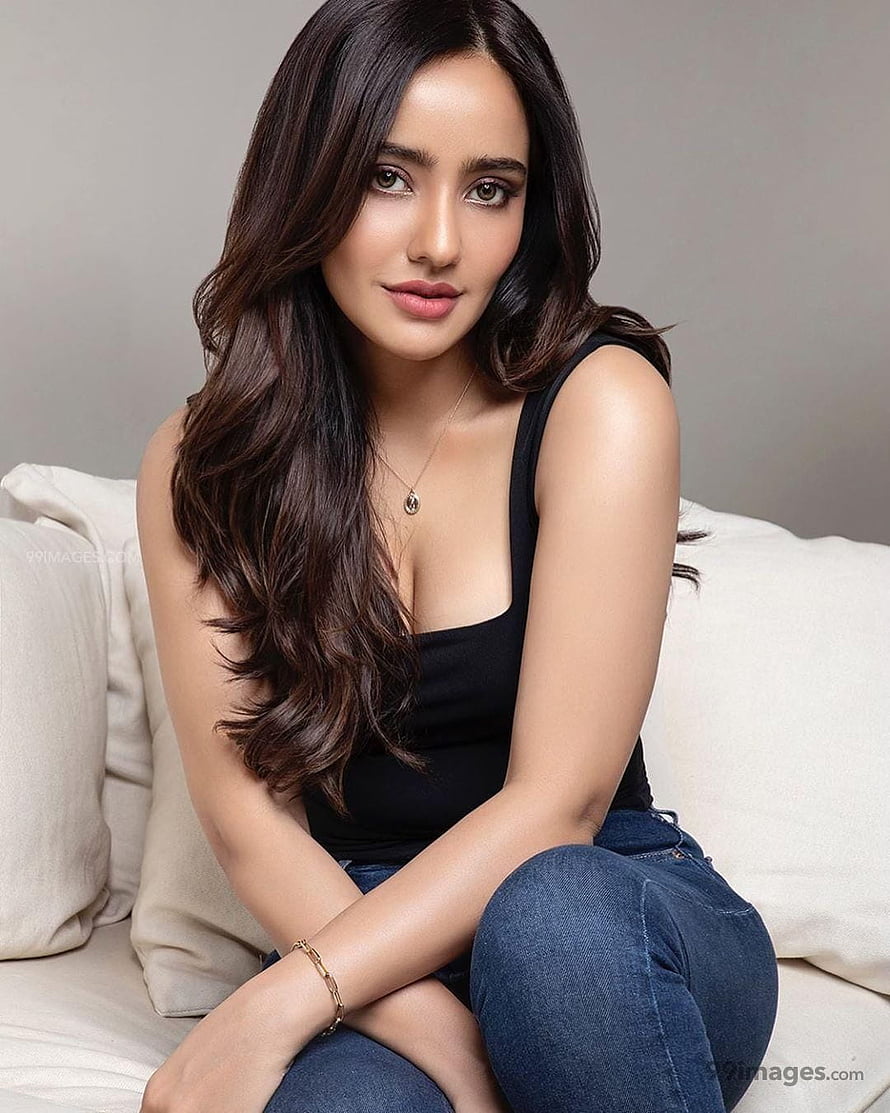 Neha Sharma Studio Portrait in Black Tank Top and Jeans HD phone wallpaper