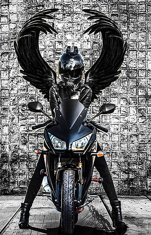 Biker Girl With Black Angel Wings On Sport Motorcycle Against Brick Wall HD phone wallpaper
