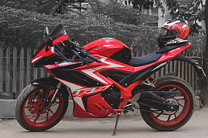 Red GPX Demon GR165R Sport Motorcycle with Matching Helmet HD wallpaper