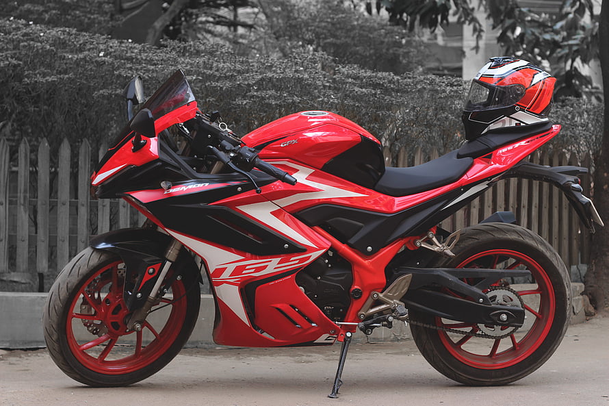 Red GPX Demon GR165R Sport Motorcycle with Matching Helmet HD wallpaper