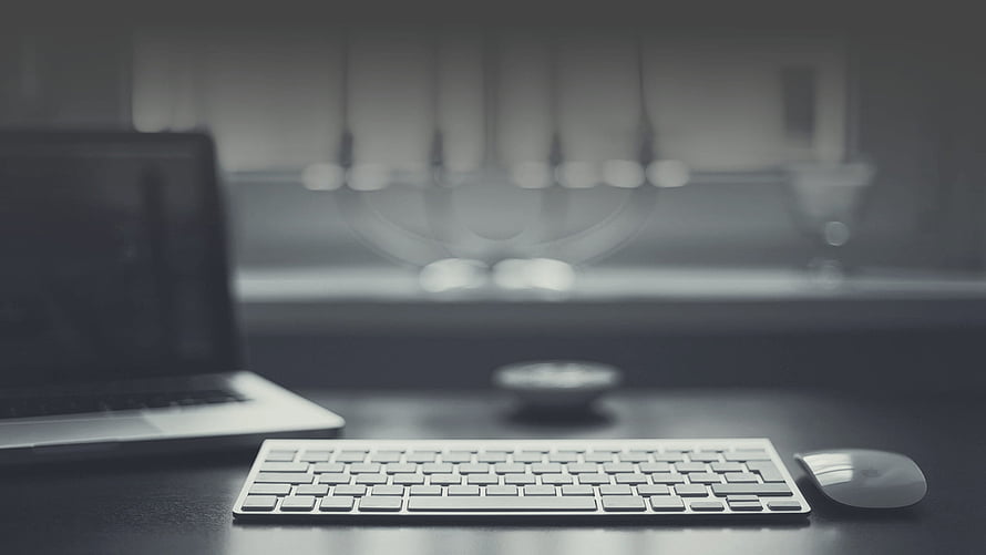 Minimalist Workspace Setup With Laptop, Keyboard, and Mouse on Dark Desk HD wallpaper