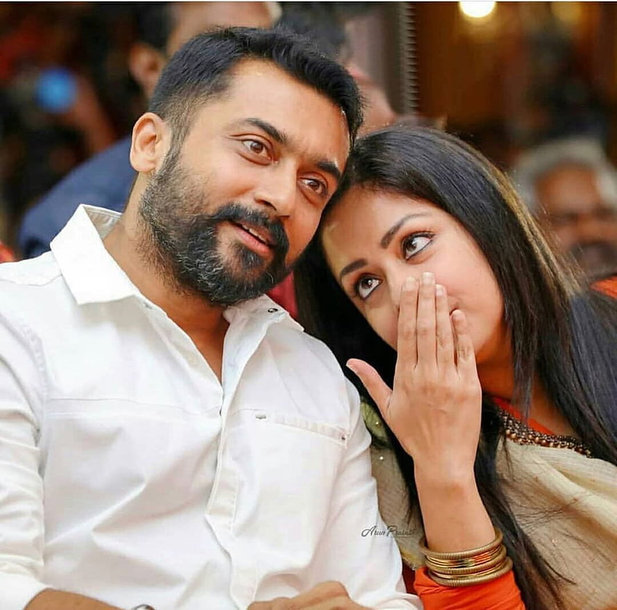 Surya and Jyothika at a public event, intimate candid moment HD wallpaper