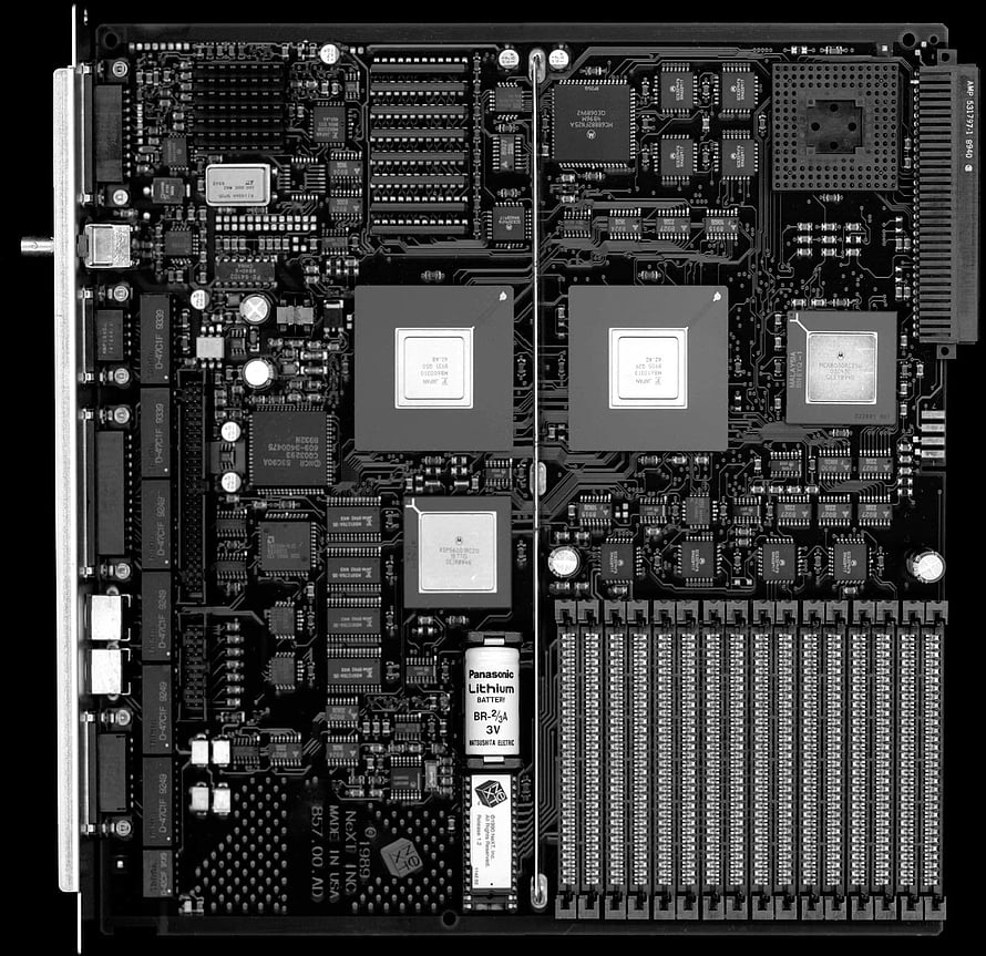 Detailed Black and White Close-Up of a Complex Computer Motherboard Circuit Board HD wallpaper