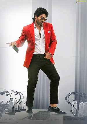 Allu Arjun in a red blazer and sunglasses on a press conference stage HD phone wallpaper