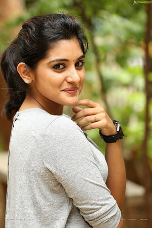 Niveda Thomas Portrait in Grey Top with Outdoor Greenery Background HD phone wallpaper