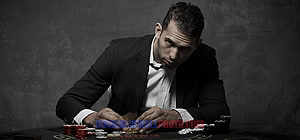 Andrew Tate Poker Portrait in Black Suit with Casino Chips HD wallpaper