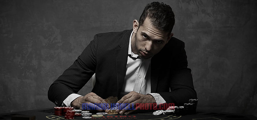 Andrew Tate Poker Portrait in Black Suit with Casino Chips HD wallpaper