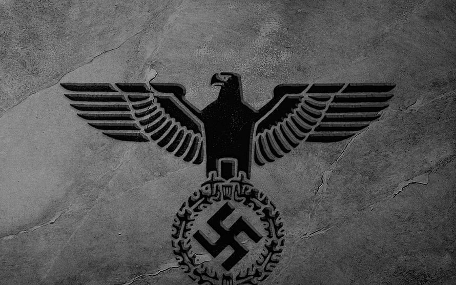 Nazi Eagle and Swastika Emblem on Cracked Concrete Wall HD wallpaper